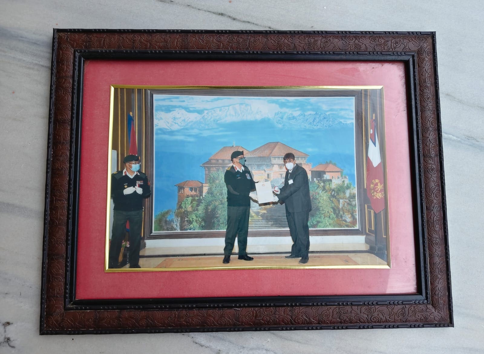 Then Chief of Army Staff Purna Chandra Thapa presenting the commendation certificate and badge to Dr. Niraj Singh.